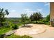Outdoor patio featuring a stone base and gorgeous views of the surrounding wooded area at 4320 Stone Post Dr, Castle Rock, CO 80108