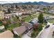 Bird's eye view shows charming neighborhood with well-maintained homes and green lawns at 4917 S Xenophon Way, Morrison, CO 80465
