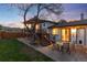 Charming backyard with a deck, stairs, and patio, perfect for outdoor entertaining with sunset views at 4917 S Xenophon Way, Morrison, CO 80465