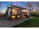 Inviting backyard featuring a deck, patio, and well-maintained lawn, great for outdoor living at 4917 S Xenophon Way, Morrison, CO 80465