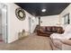 Basement with stairs, seating and a dark ceiling at 4917 S Xenophon Way, Morrison, CO 80465