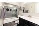 Modern bathroom with stylish tiling, a vanity with sink, and a walk-in shower at 4917 S Xenophon Way, Morrison, CO 80465