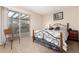 Comfortable bedroom featuring a sliding glass door leading to an outdoor deck at 4917 S Xenophon Way, Morrison, CO 80465