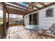 Relaxing outdoor deck with partial pergola, iron railing, and scenic views at 4917 S Xenophon Way, Morrison, CO 80465