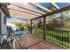 Cozy deck with seating area, pergola, and backyard views, perfect for relaxing outdoors at 4917 S Xenophon Way, Morrison, CO 80465