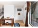 Inviting entryway with hardwood floors, Colorado flag decor, and natural light at 4917 S Xenophon Way, Morrison, CO 80465