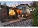 Well-lit exterior shot showing a home with rocks, landscaping and a brick facade at 4917 S Xenophon Way, Morrison, CO 80465