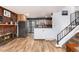 Open concept kitchen and living room featuring a brick fireplace and stainless steel appliances at 4917 S Xenophon Way, Morrison, CO 80465