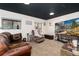 Cozy living room with comfortable seating, a large television, and natural light at 4917 S Xenophon Way, Morrison, CO 80465