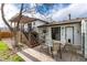 Backyard patio with a table and chairs next to the deck, perfect for outdoor relaxation at 4917 S Xenophon Way, Morrison, CO 80465
