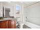 Cozy bathroom features modern fixtures, vanity with storage, and a shower and tub combo at 12997 Wyandot Way, Westminster, CO 80234