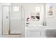 Bright bathroom featuring a glass-enclosed shower and a relaxing soaking tub at 12997 Wyandot Way, Westminster, CO 80234