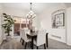 Inviting dining room with modern lighting and seamless access to an outdoor patio at 12997 Wyandot Way, Westminster, CO 80234