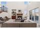 Bright and airy living room with high ceilings, a fireplace, and access to the outdoor space at 12997 Wyandot Way, Westminster, CO 80234