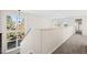 Bright loft area with carpet, neutral paint and large window at 12997 Wyandot Way, Westminster, CO 80234