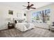 Serene main bedroom with a large window providing ample natural light and plush carpeting at 12997 Wyandot Way, Westminster, CO 80234