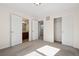 Bright bedroom featuring neutral paint, carpet, and a bathroom, and walk-in closet at 12997 Wyandot Way, Westminster, CO 80234