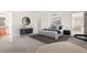 Bedroom featuring neutral decor, a black dresser, and a large bed at 12997 Wyandot Way, Westminster, CO 80234