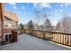Wooden deck overlooking a landscaped yard and trees, providing a tranquil outdoor space at 12997 Wyandot Way, Westminster, CO 80234