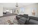 Spacious living room with plush carpeting and theater seating, featuring natural light at 12997 Wyandot Way, Westminster, CO 80234
