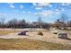 Community playground with clubhouse and gazebo in background at 12997 Wyandot Way, Westminster, CO 80234