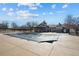 Community pool covered for the off-season, with clubhouse in background at 12997 Wyandot Way, Westminster, CO 80234