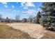 Enjoy a fun volleyball match on the community sand court amidst well-maintained landscaping and neighborhood homes at 12997 Wyandot Way, Westminster, CO 80234