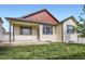 Expansive backyard featuring a well-maintained lawn, patio, and the home's distinctive siding and trim at 3572 Lissa Dr, Berthoud, CO 80513