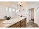 A spacious bathroom featuring double sinks, modern fixtures, and a well-lit interior at 3572 Lissa Dr, Berthoud, CO 80513