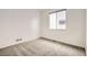 Cozy bedroom featuring neutral walls, carpet, and a window providing natural light, offering a calming space at 3572 Lissa Dr, Berthoud, CO 80513