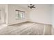 Spacious bedroom bathed in natural light from a large window, complete with plush carpeting at 3572 Lissa Dr, Berthoud, CO 80513