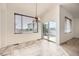 The dining area features large windows and glass doors, offering ample natural light and easy access to outdoor spaces at 3572 Lissa Dr, Berthoud, CO 80513
