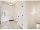Bright foyer featuring tile floors, a closet, modern light fixtures and a glass window above the door at 3572 Lissa Dr, Berthoud, CO 80513