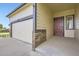 Front exterior of this home with a two-car garage and brick veneer on the corner posts at 3572 Lissa Dr, Berthoud, CO 80513