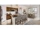 A spacious kitchen with an island, a dining table and wooden cabinets at 3572 Lissa Dr, Berthoud, CO 80513