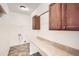 Functional laundry room with countertop, cabinetry, and utility hookups for convenient household tasks at 3572 Lissa Dr, Berthoud, CO 80513