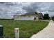 View of the property from the street with a lawn and light-colored two-story home featuring a two-car garage at 3572 Lissa Dr, Berthoud, CO 80513