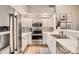 Bright kitchen featuring stainless appliances, ample cabinet space, and modern finishes at 3912 S Carson St # 204, Aurora, CO 80014