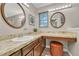 Bathroom featuring dual vanities and makeup counter at 5543 S Kenton Ct, Englewood, CO 80111