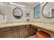 Bathroom featuring dual vanities and makeup counter at 5543 S Kenton Ct, Englewood, CO 80111