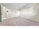 Bright bedroom features neutral carpet, a double closet, and ensuite bathroom entrance at 5543 S Kenton Ct, Englewood, CO 80111
