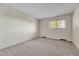 Empty carpeted room with a window at 5543 S Kenton Ct, Englewood, CO 80111