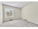 This bright bedroom has neutral carpets and a large window for natural light at 5543 S Kenton Ct, Englewood, CO 80111