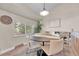 Cozy dining area with modern lighting, a round table, and views of the outdoors offers a charming space to entertain guests at 5543 S Kenton Ct, Englewood, CO 80111