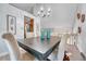 Bright dining area features a decorative chandelier and decor with lots of natural light at 5543 S Kenton Ct, Englewood, CO 80111