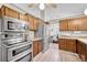 Modern kitchen with stainless steel appliances, ample cabinet space, and an open layout, perfect for cooking and entertaining at 5543 S Kenton Ct, Englewood, CO 80111