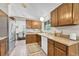 Well-lit kitchen features wood cabinets, laminate countertops, stainless steel appliances, and a practical layout at 5543 S Kenton Ct, Englewood, CO 80111