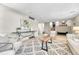 Open living space with a stylish rug, neutral decor, and seamless flow, ideal for modern living and entertaining at 5543 S Kenton Ct, Englewood, CO 80111