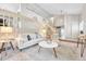 Neutral-toned living room with high ceilings, modern furnishings, staircase railing and a large rug at 5543 S Kenton Ct, Englewood, CO 80111
