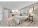 Well-lit main bedroom includes an ensuite bath and ample closet space at 5543 S Kenton Ct, Englewood, CO 80111